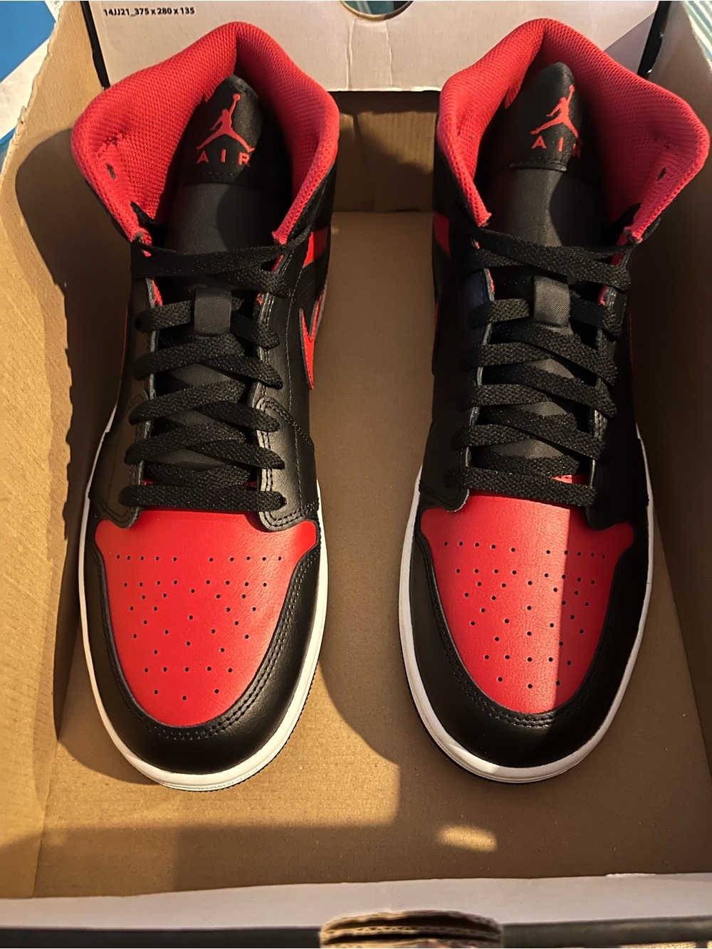 Jordan Black and Red Mid-Top Sneakers